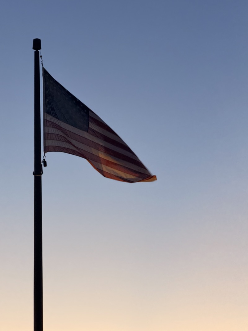 American flag at sunset during a deployment